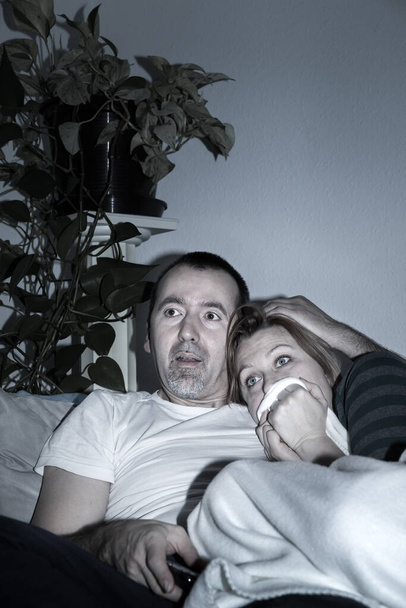 Couple is watching Television at home - 写真・画像
