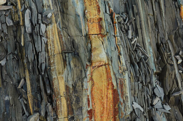 Rock layers - a colorful formations of rocks stacked over the hundreds of years. Interesting background with fascinating texture. - Photo, Image