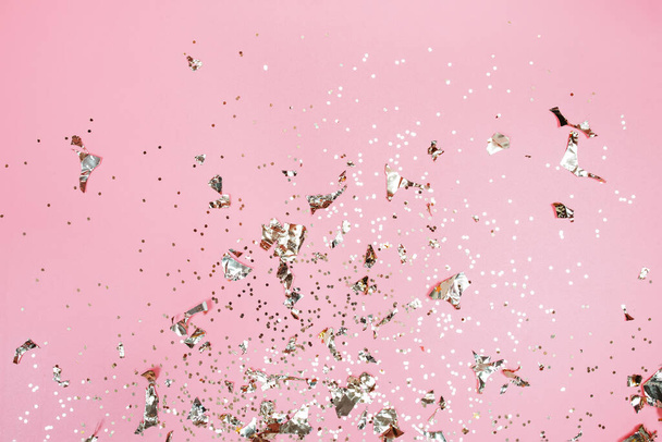 Golden stars glitter on pink background. Festive holiday pastel backdrop. - Foto, Imagen