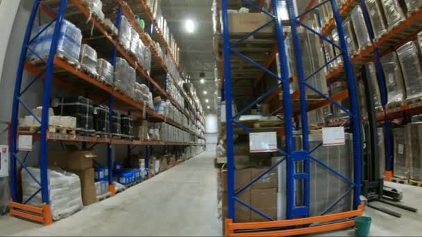 Loader in warehouses. Stacks of boxes in an industrial warehouse. - Footage, Video