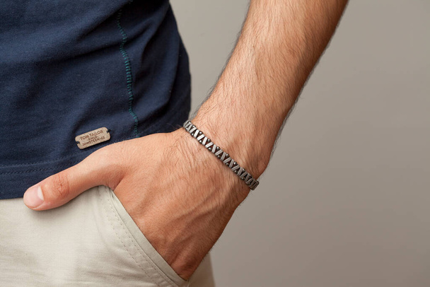Wristband models worn on male model wrist. - Zdjęcie, obraz