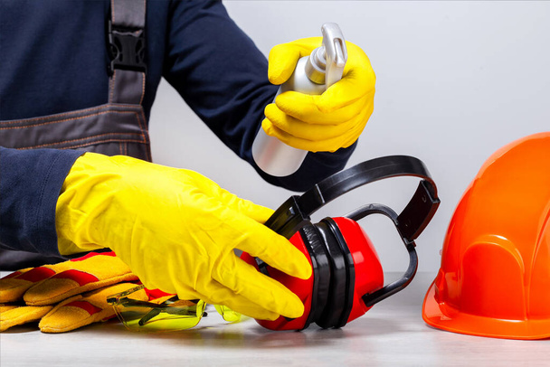 Worker disinfecting work space, protective clothing. Coronavirus treatment concept. - Fotó, kép