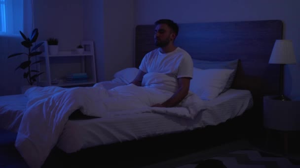 Male sleepwalker in bedroom at night - Footage, Video