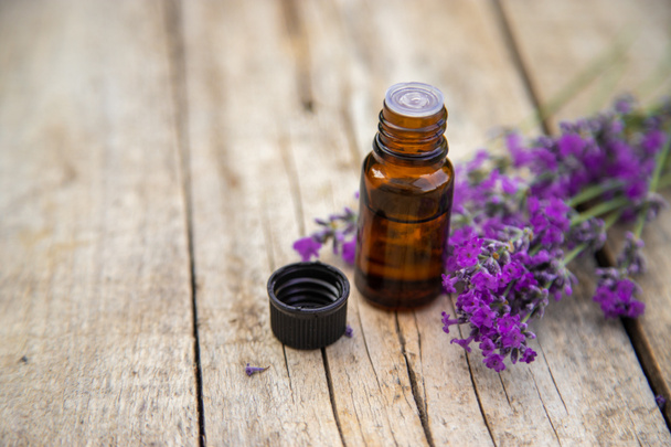 Lavender essential oil in a small bottle. Selective focus.nature. - Foto, Imagem