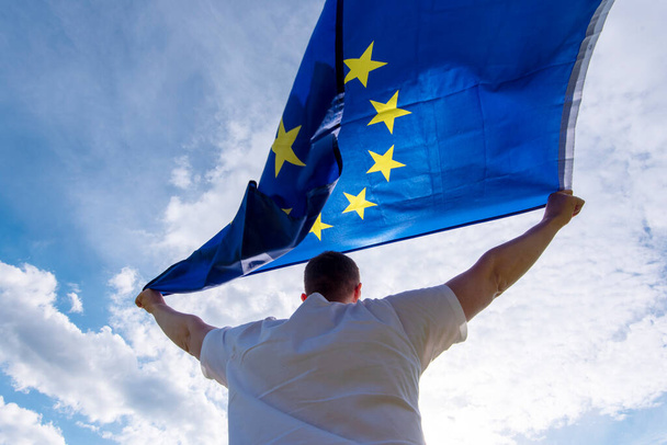 Man holding EU Flag or European Union flag, concept picture - Foto, immagini