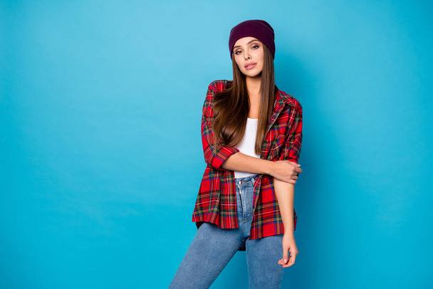 Photo of amazing stylish trendy lady enjoy spring weather street clothes self-confident look tender look eyes wear casual hat plaid shirt jeans isolated blue color background - Foto, Bild