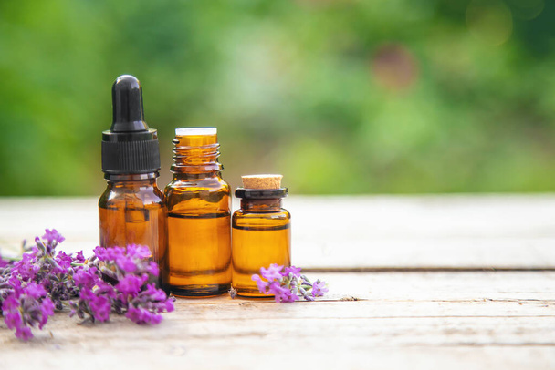 Lavender essential oil in a small bottle. Selective focus.nature. - Foto, Imagem