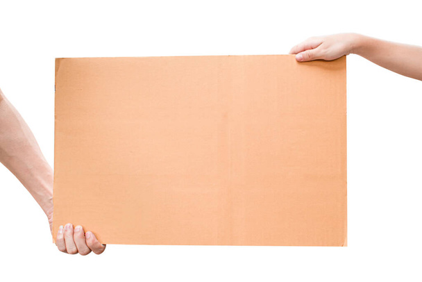 Two hand holding blank brown paper isolated on white background with clipping path - Foto, immagini