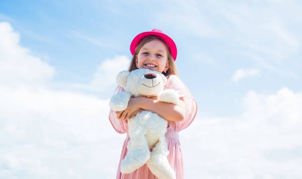 Excitement. teddy bear shop. toy shop for kids. happy childrens day. childhood happiness. little cheerful child with present. fluffy and cute gift. happy birthday. small girl play with bear toy - Fotó, kép