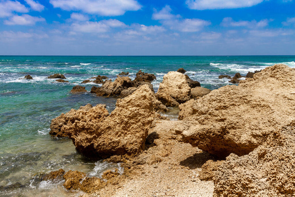Nice view of stone cliffs on Givat Olga beach in Hadera. Israel. - Photo, Image