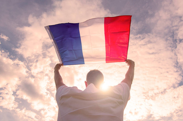 Man holding Flag of France, concept picture - 写真・画像