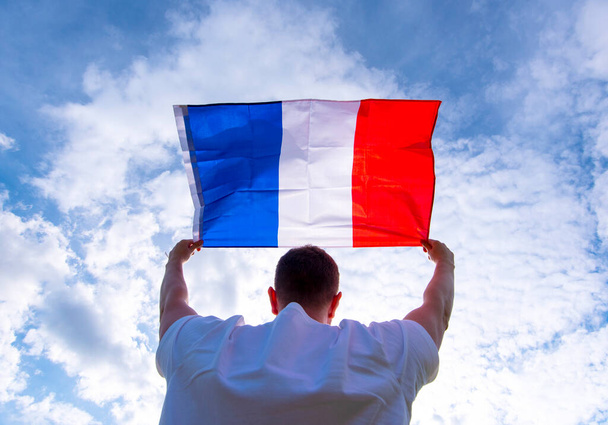 Man holding Flag of France, concept picture - 写真・画像