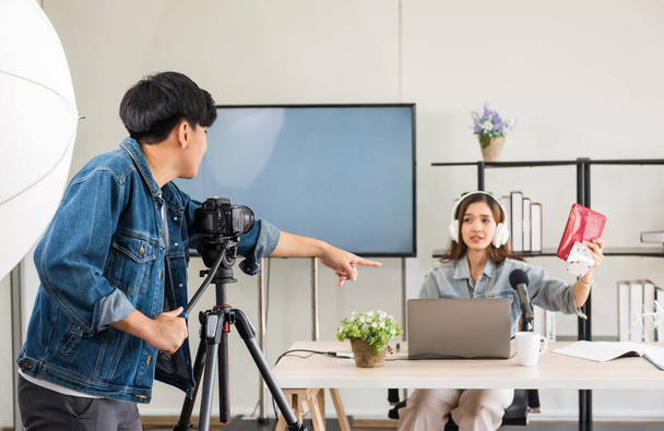 Behind the scene concept. Videographer setup before streaming live online content of beautiful attractive Asian woman blogger podcaster with studio lighting. broadcasting vlogger, internet influencer. - Photo, Image