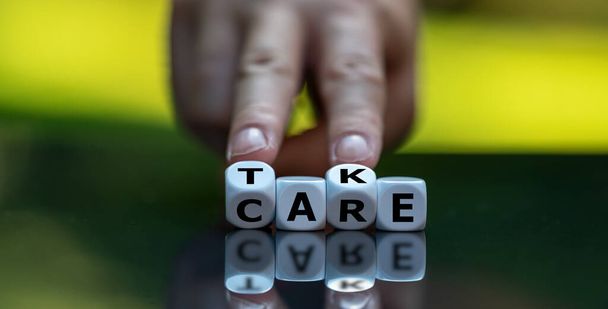 Dice form the expression "take care". - Photo, Image
