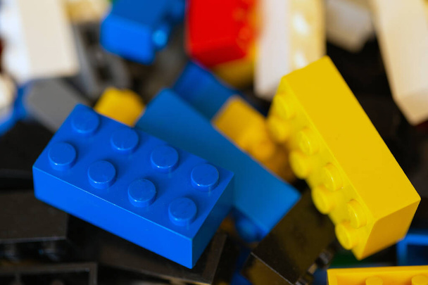Plastic toy blocks various colored lego blocks for children. Game for kids construction building with plastic blocks - Fotó, kép
