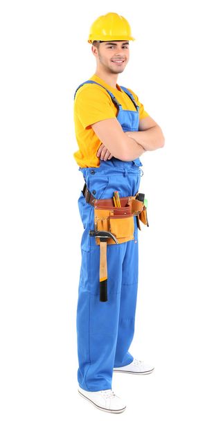 Male builder in yellow helmet isolated on white - Foto, afbeelding