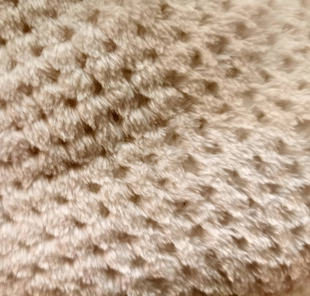 artificial fur with geometical texture of light brown blossom - Photo, Image