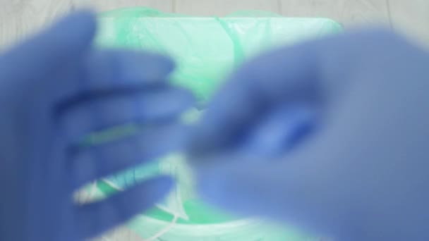 Doctor Throws Away to the Garbage in Slow Motion Disposable Gloves and Mask Used and Contaminated After Finishing the Hospital Service Shift - Video, Çekim