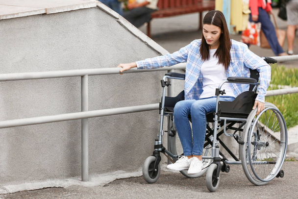 Young woman in wheelchair outdoors - Photo, Image