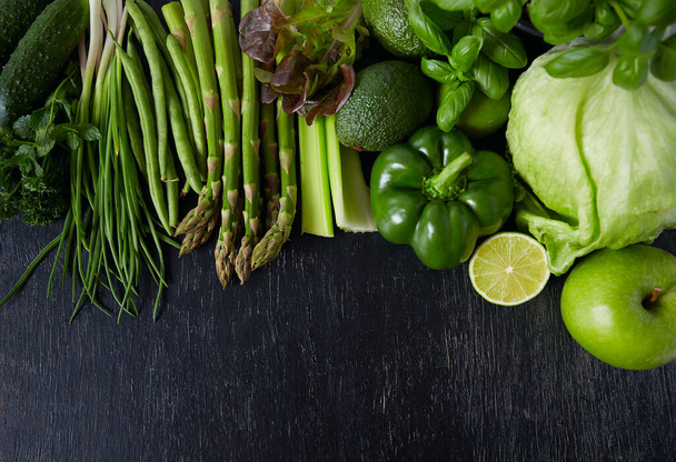 green vegetables and herbs on black chalkboard - Fotografie, Obrázek