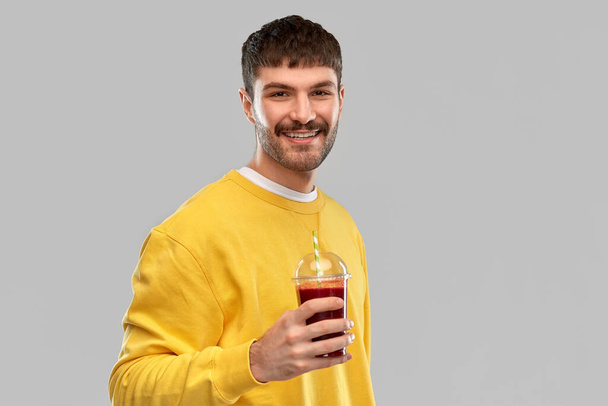 happy man with tomato juice in takeaway cup - Zdjęcie, obraz