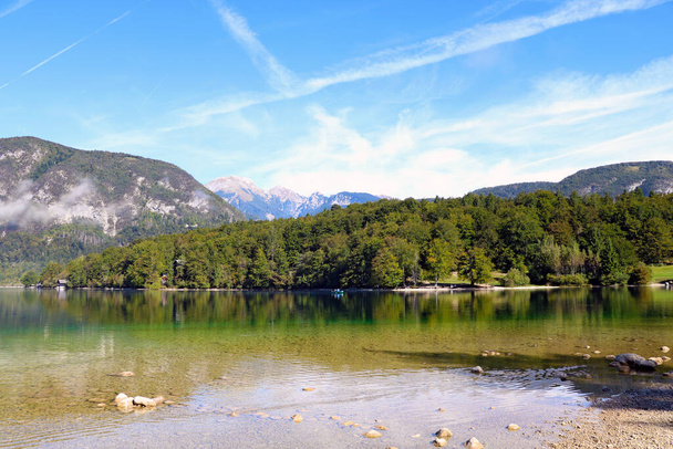 Bohinj lake shore with mountain views in Slovenia - Fotoğraf, Görsel