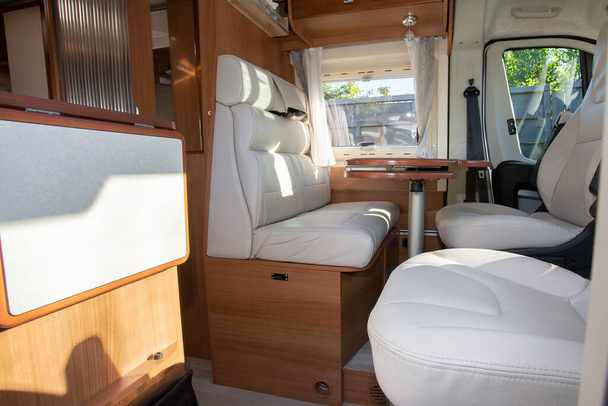 Camper Dining Room place with wooden white interior in front van seat vanlife - Photo, Image