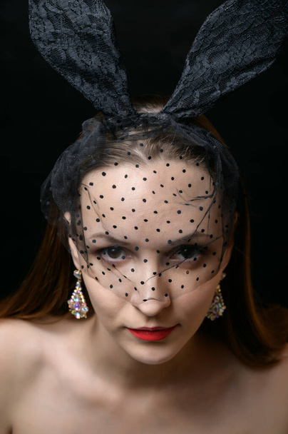 Portrait of beautiful sensual woman with veil and bunny ears. - Zdjęcie, obraz