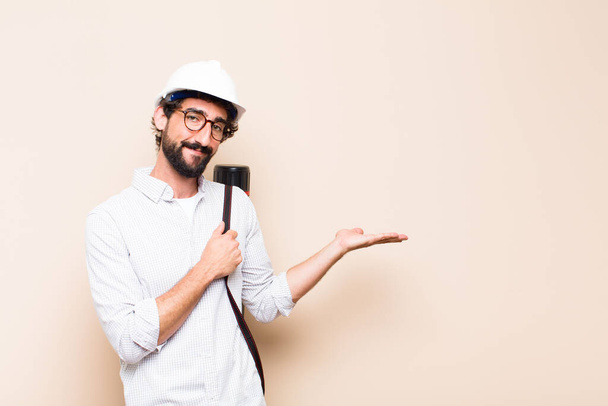 young  bearded architect man pointing to the side - Foto, Imagem