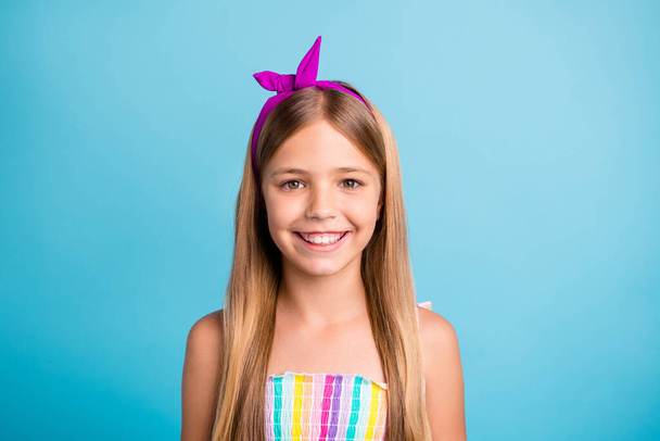 Close-up portrait of her she nice attractive lovely cute toothy cheerful cheery long-haired pre-teen girl wearing off-shoulder blouse isolated over bright vivid shine vibrant blue color background - Foto, Imagem
