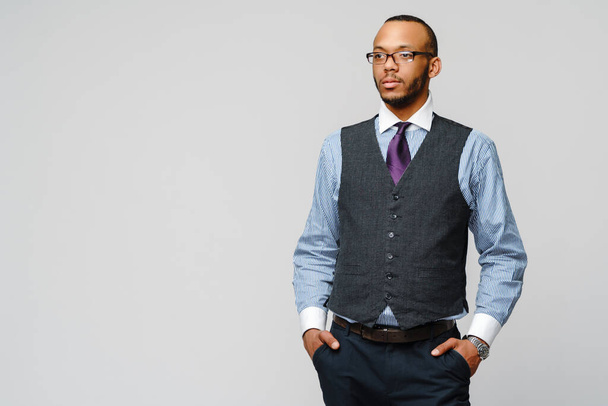 African-American businessmanman wearing glasses portrait over grey background - Foto, immagini