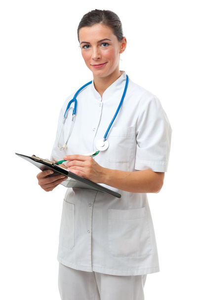 Doctor writing on clipboard - Photo, Image