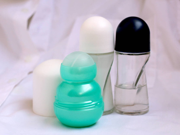 A set of ball deodorants on a white cloth, skincare - Fotó, kép