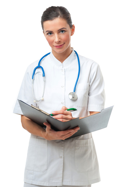 Female doctor writing on clipboard - Photo, Image