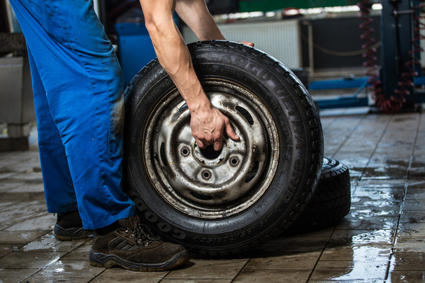 Carrying tires - Photo, Image
