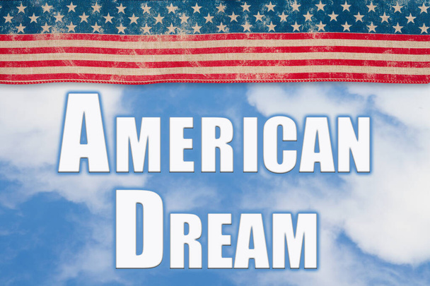 American Dream word message with retro USA stars and stripes ribbon clouds and sky - Фото, изображение
