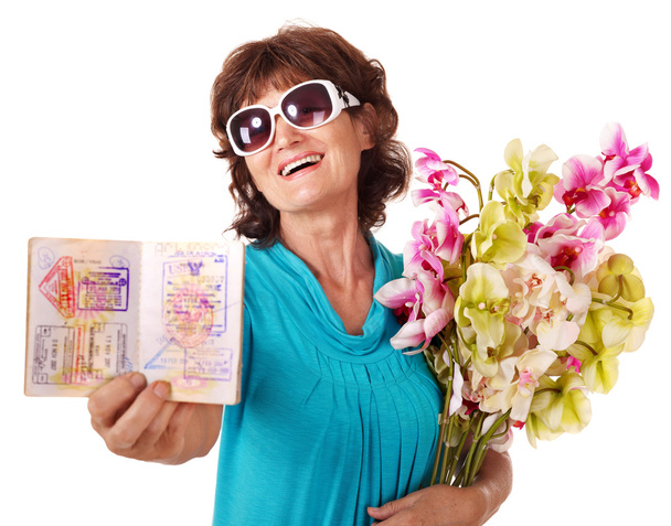 Senior woman holding bunch of flowers. - Foto, afbeelding