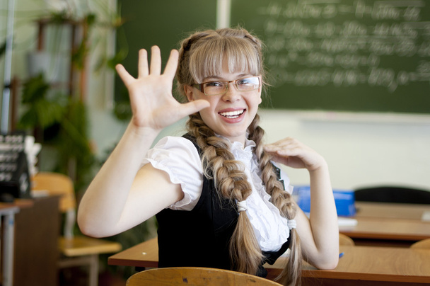 Schoolgirl on board background - Foto, imagen