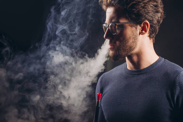 cool guy with smoke from nose - 写真・画像