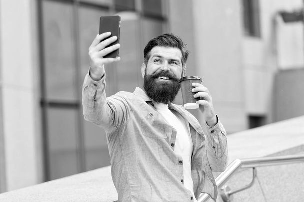 Video call. Internet surfing social networks with smartphone. Mobile phone always with me. Man use smartphone. Modern life. Man with smartphone drinking coffee. Energy for communication. Coffee time - Fotoğraf, Görsel