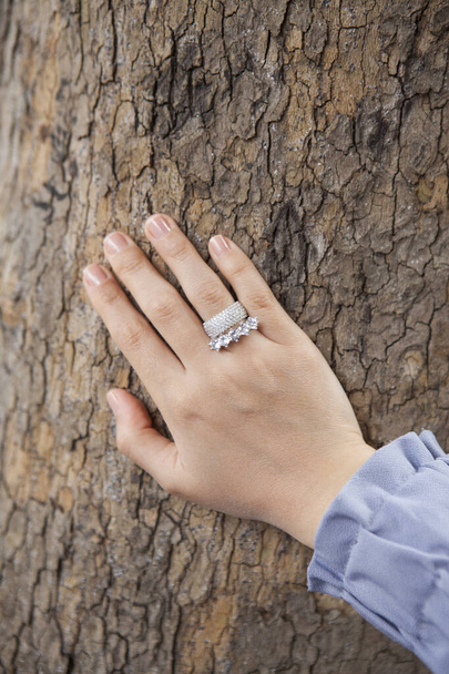 Women's accessory, silver women's ring on finger, stylish gold ring. - Zdjęcie, obraz