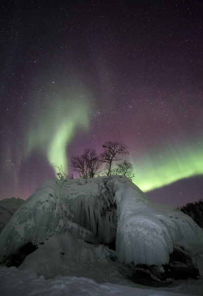 Aurora Borealis Northern Lights in Lake Tornetrask, Abisko, Northern Sweden - Photo, Image