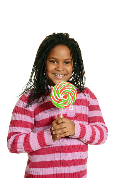 Little black girl with big lollipop - Photo, image