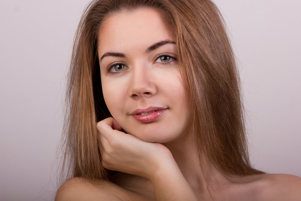 Studio portrait of a beautiful young woman with blond long hair without makeup - Fotó, kép