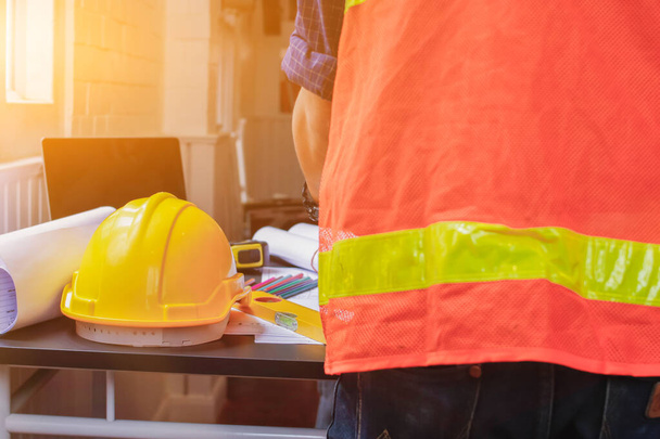 Soft Focus,The contractor has prepared a helmet to wear before entering the construction area. Safety helmets are a safety protection device in construction sites for professional construction workers - Φωτογραφία, εικόνα