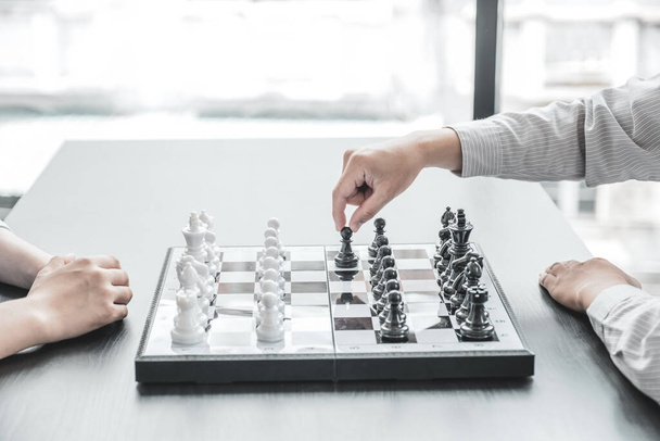 hand move chess with strategy and tactic to win enemy, play battle on board game, business opportunity  competition strategic challenge concept. - Foto, imagen