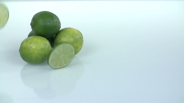 Pile of limes with falling slices of the same citrus - Footage, Video