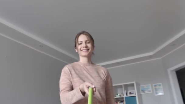 Attractive Lady Having Fun and Dance During Clean-Up at Home, Creative Concept - Кадры, видео
