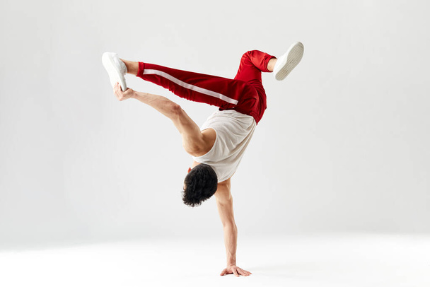 Modern dancer standing on one hand - Photo, Image
