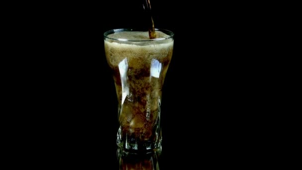 Filling up a glass with coke in slow motion - Footage, Video